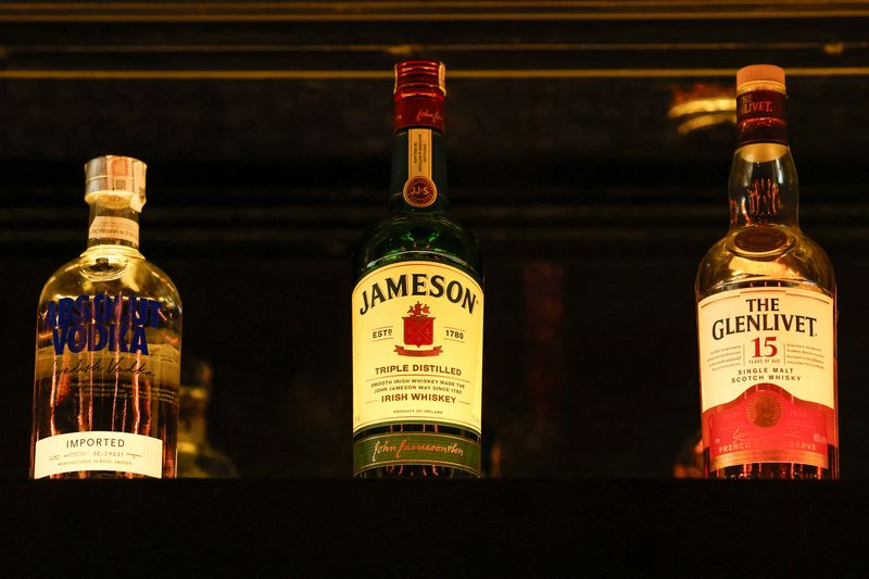 © Reuters. FILE PHOTO: Bottles of Pernod Ricard's brands are displayed at a bar during a photo opportunity, in Gurugram, India, November 26, 2024. REUTERS/Priyanshu Singh/File Photo